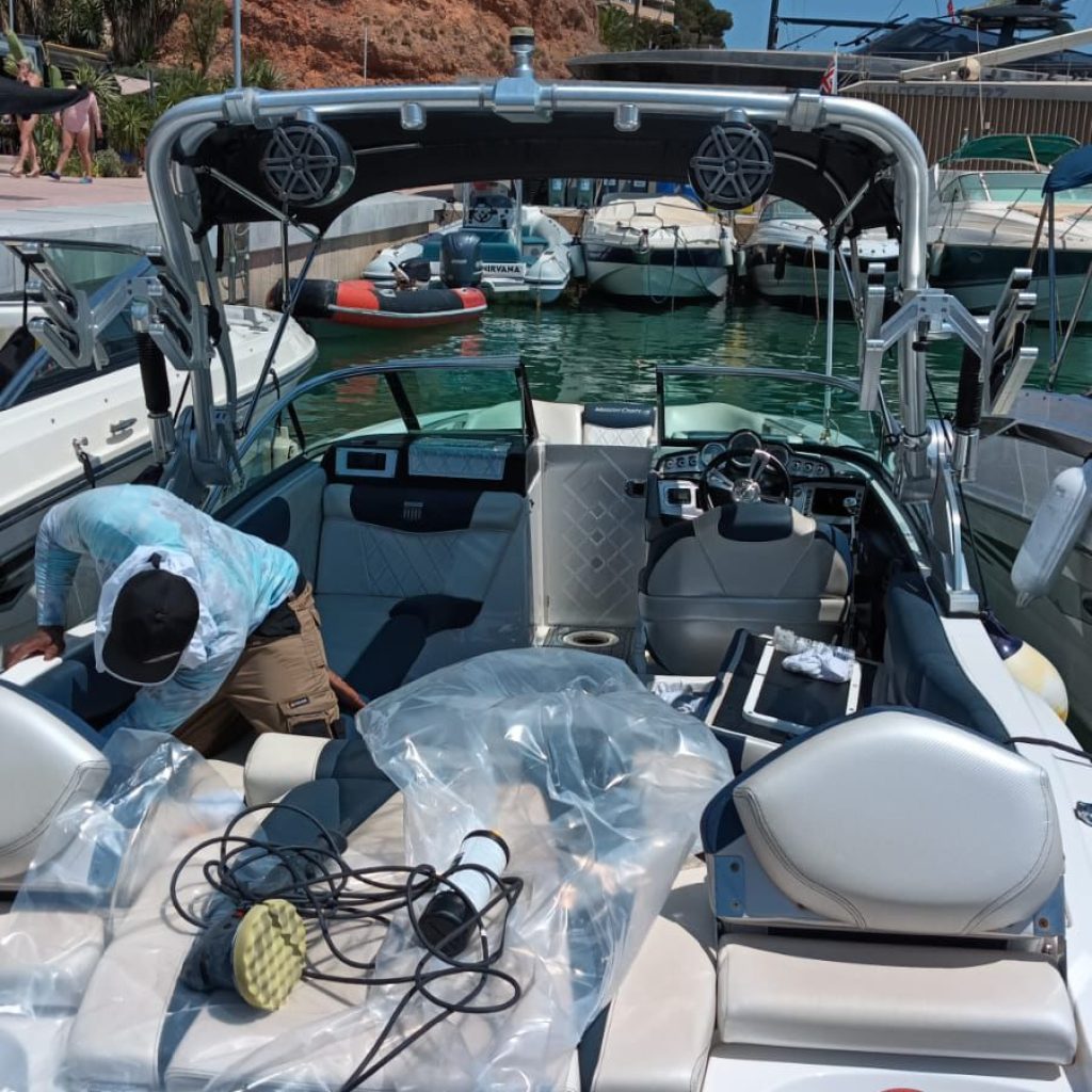 Worker Detailing a Master Craft Boat